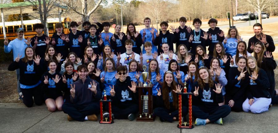 Starr’s Mill swim poses with their trophies from the 2025 Fayette County Championship. The team together won the competition, while boys placed second and girls placed first. 
Photo via starrsmillswimming.com